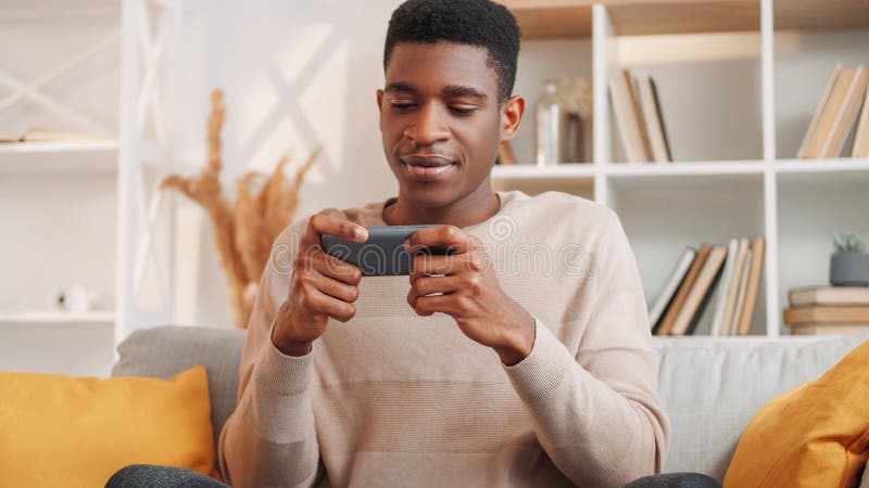 Smiling African Boy Playing Online Games in Class Stock Photo - Image of  phone, modern: 177228872