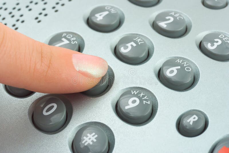 Phone keypad and woman finger