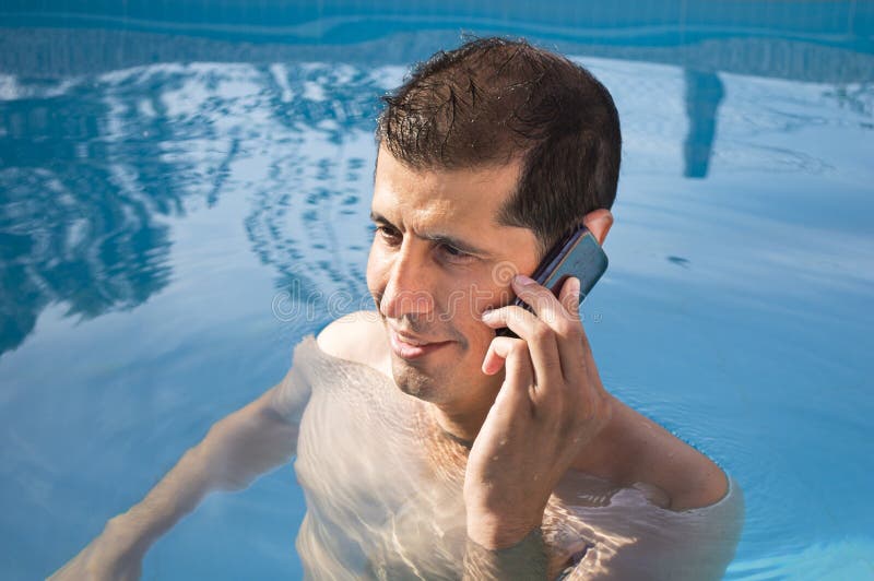 Phone by swimming pool stock image. Image of copy, businessman 33187249