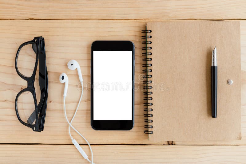 Phone white screen on wood workspace top angle view