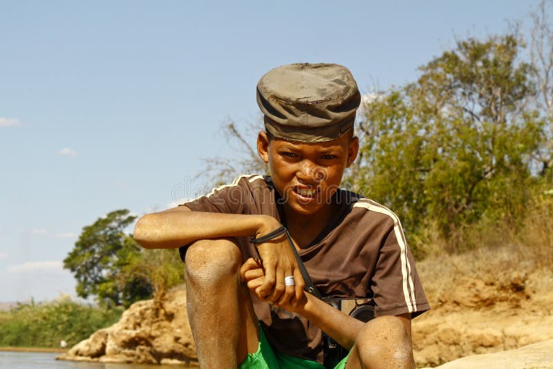 Photo of Adorable Young Happy Boy - African Poor Child on the Ri Stock ...