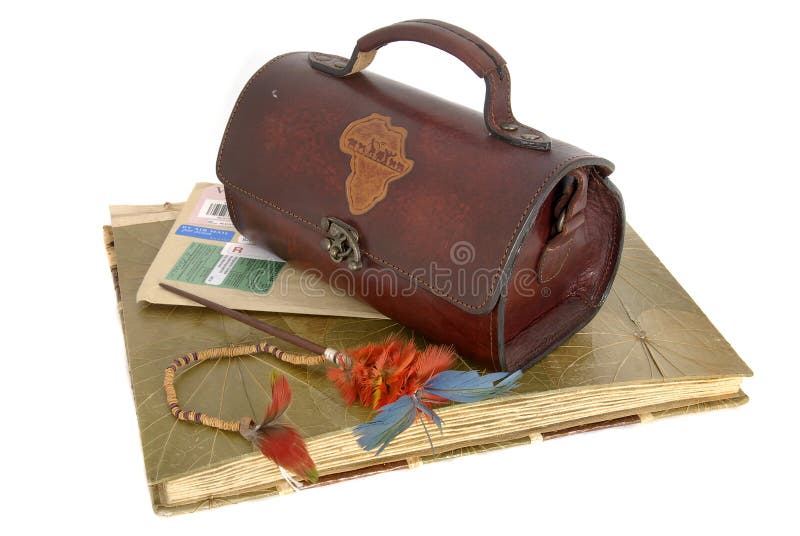 Old photo album with etnic feathers and purse isolated against a white background. Adventurer adventure stock images, royalty-free photos and pictures