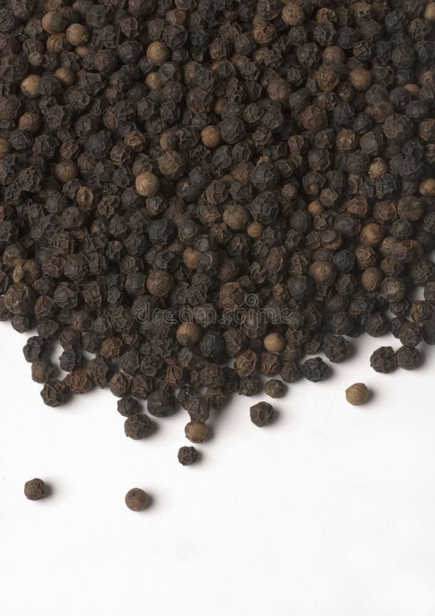 Black Peppercorns in a Pestle and Mortar and Ground Pepper Stock Photo