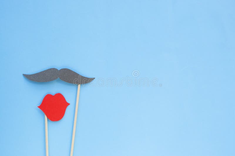 Photo booth props moustache and lips on blue background. royalty free stock photos Photo booth props moustache and lips on blue background. royalty free stock photos