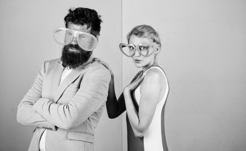 Photo booth props. party fun. couple in love. hipster guy and girl party glasses. friendship. lets celebrate together