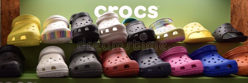 Photo of bright colorful rows of CROC Shoes