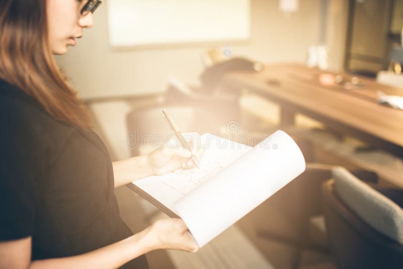 Business womanlooking smartphone and holding documents in hands. Open space loft office,young business woman. Photo business woman wearing suit, looking royalty free stock photo Business womanlooking smartphone and holding documents in hands. Open space loft office,young business woman. Photo business woman wearing suit, looking royalty free stock photo