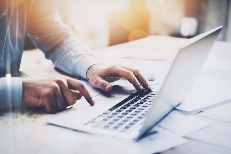 Photo businessman working with generic design notebook. Typing message, hands keyboard. Blurred background, bokeh effect royalty free stock image