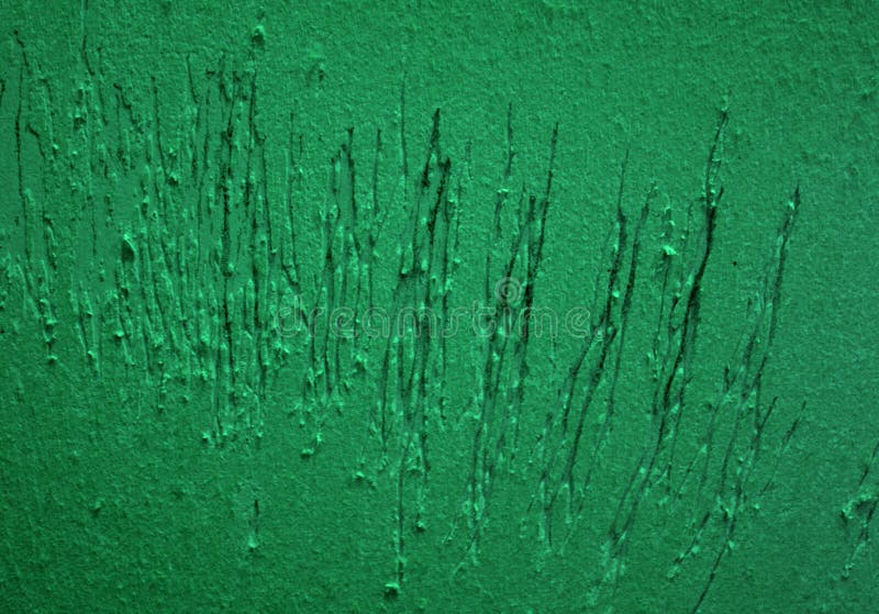 A cat scratches on the wall