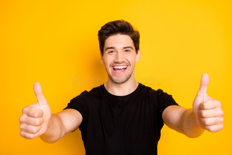 Photo of Cheerful Handsome Attractive Man Showing You Thumbs Up Smiling ...