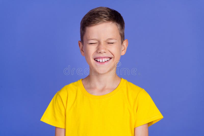 Photo of cheerful pretty glad child boy wear yellow clothes laughing isolated on purple color background