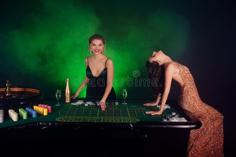 Photo of attractive chic vip girls poker players have fun in las vegas winning million jackpot. Photo of attractive chic vip girls poker players have fun in las vegas winning million jackpot.