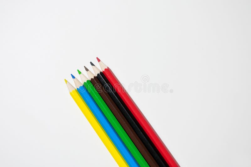 Photo of Colored Pencils Lined Up in a Row at an Angle on a White