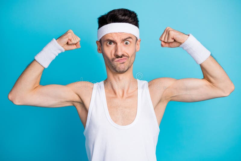 Photo of Concentrated Sporty Guy Show Muscles Hands Wear White Tank-top ...