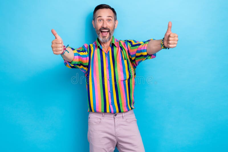 Photo of crazy stylish charismatic man showman thumbs up rejoice enjoy concert disco weekend holiday isolated on blue royalty free stock photography