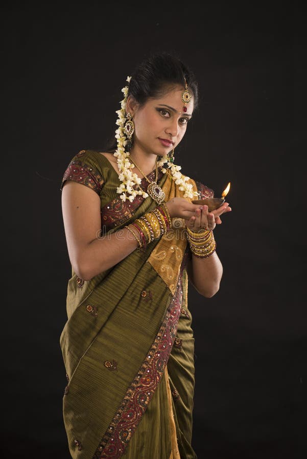 Diwali or deepavali photo with female holding oil lamp during festival of light photo. Diwali or deepavali photo with female holding oil lamp during festival of light photo