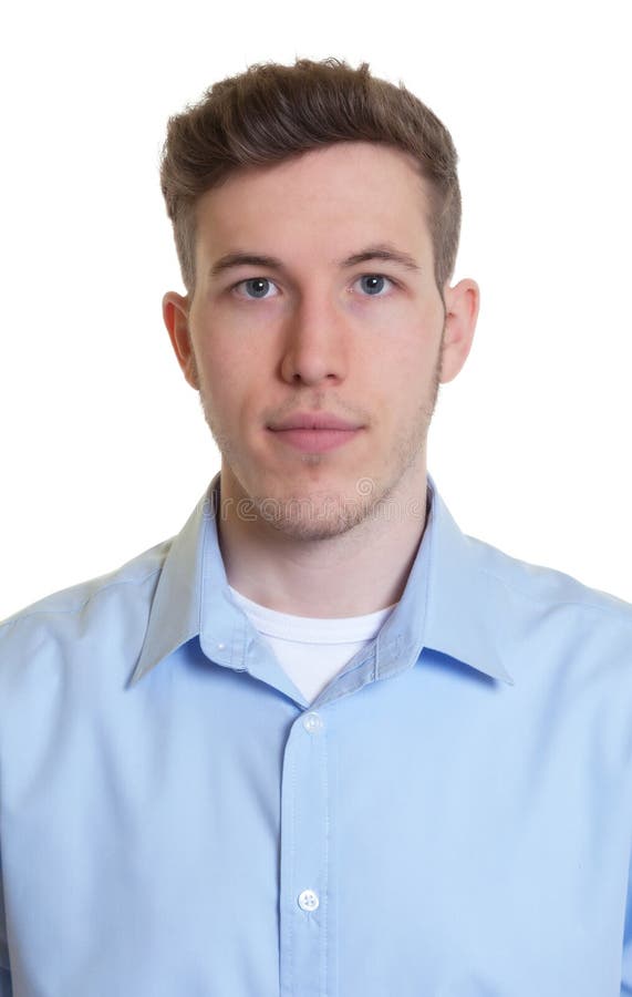 Passport picture of a cool guy in a blue shirt on an isolated white background for cut out. Passport picture of a cool guy in a blue shirt on an isolated white background for cut out