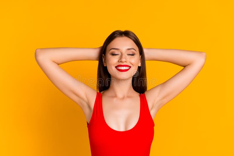 Photo Of Dreamy Cute Lady Dressed Bodysuit Closed Eyes Arms Behind Head Yellow Color Background