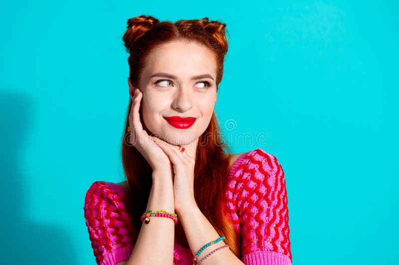 Photo of dreamy shiny lady dressed pink knitted shirt arm cheek looking empty space isolated blue color background royalty free stock images