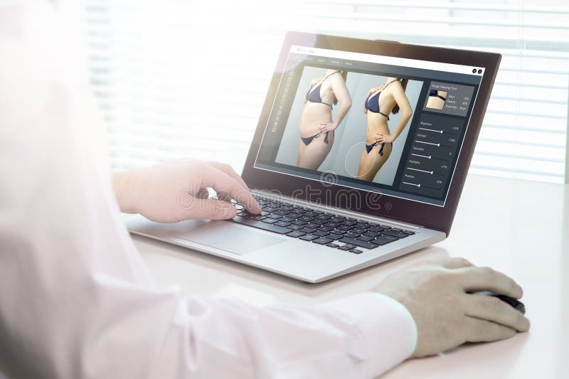 Photo editing with laptop and software. Retouching a photo of a girl in underwear for marketing or advertisement. Heavy image post processing and beauty standards concept. Computer editing stock images, royalty-free photos and pictures