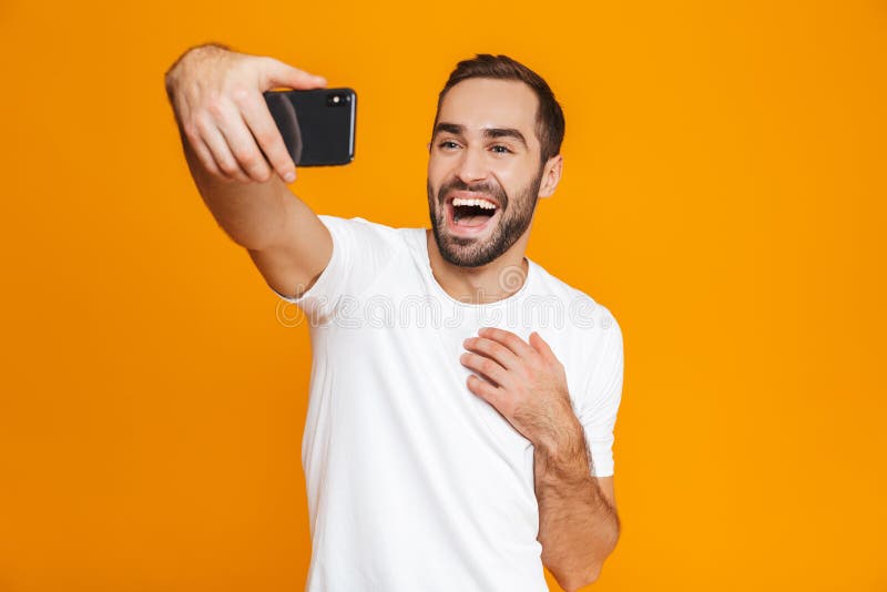 Photo of European Guy 30s in Casual Wear Laughing and Taking Selfie on ...