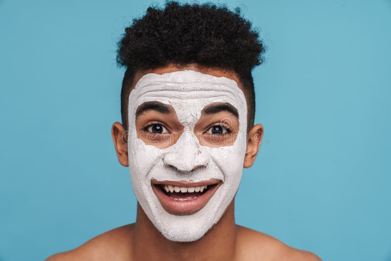 Photo of Excited African American Man in Facial Mask Smiling at Camera ...