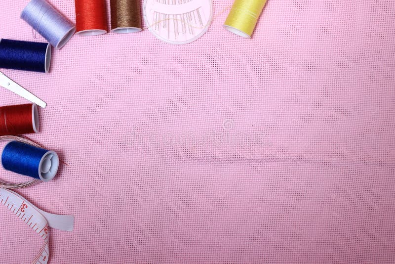Flat lay or top view, needle, scissor, thread, tailor Meter, at Pink Background royalty free stock photos
