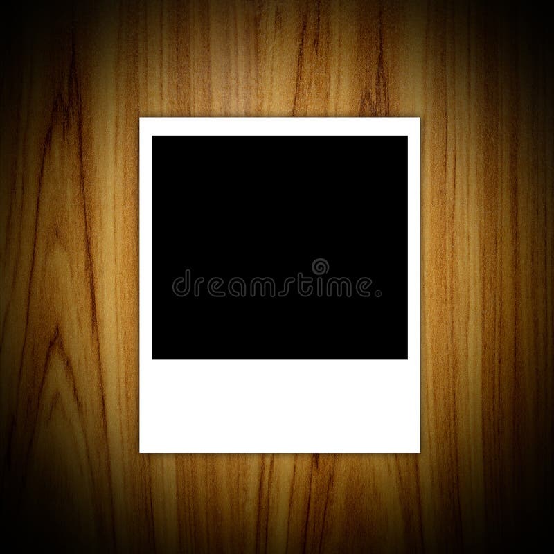 Photo frames on the wood texture