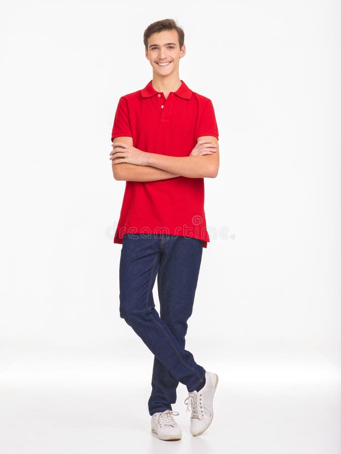 Photo of full length portrait of  young happy smiling man isolated on a white background. Portrait of smiling handsome guy posing