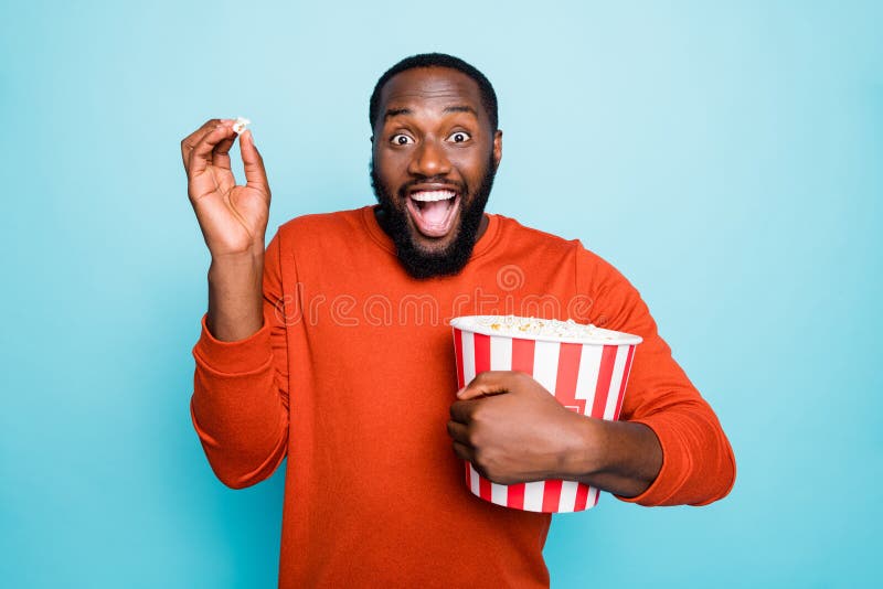 Photo of funny atonished mixed-race crazy ecstatic screaming man watching television series and amazed about plot royalty free stock photography