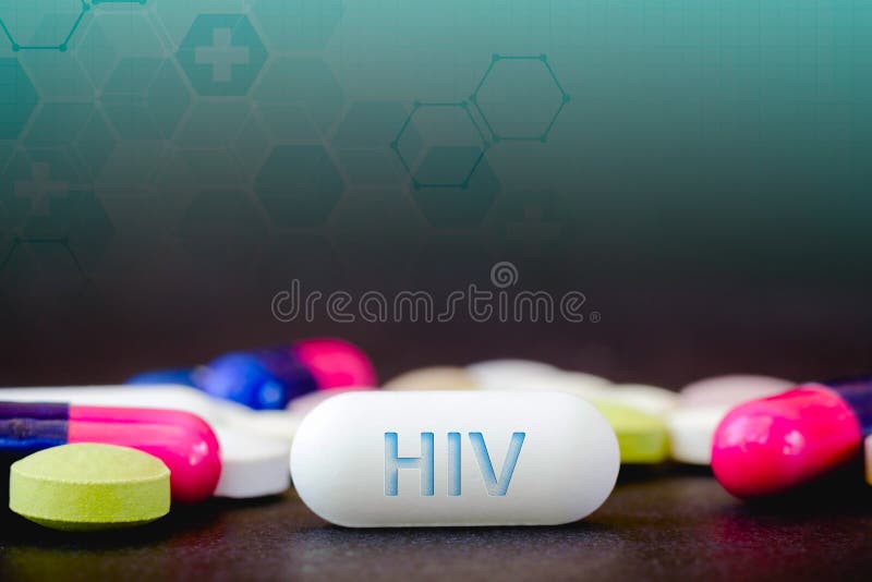 In this photo illustration pills of pharmaceutical drugs of various colors. Text HIV in one white pill. Healthcare and medicine