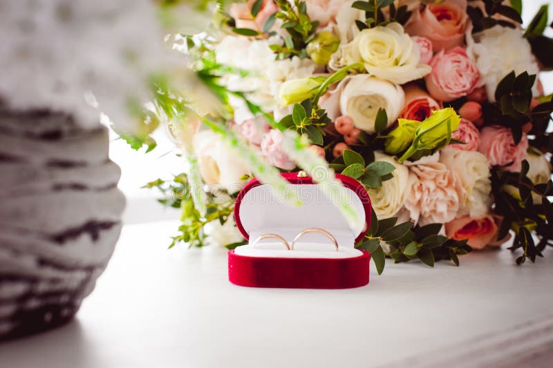 Photo Image of a Red Velvet Box with Wedding Rings of the Bride and ...