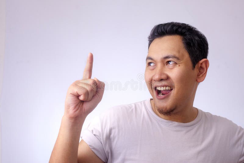 Photo image of young Asian man looked happy thinking and looking up, having good idea. Half body portrait against white wall with copy space indonesian malaysian thai handsome male casual background adult guy studio thoughtful grey smile human business people youth student face expression attractive person concept model shirt teenager dreaming above happiness smiling standing upwards positive contemplating facial solution problem. Photo image of young Asian man looked happy thinking and looking up, having good idea. Half body portrait against white wall with copy space indonesian malaysian thai handsome male casual background adult guy studio thoughtful grey smile human business people youth student face expression attractive person concept model shirt teenager dreaming above happiness smiling standing upwards positive contemplating facial solution problem