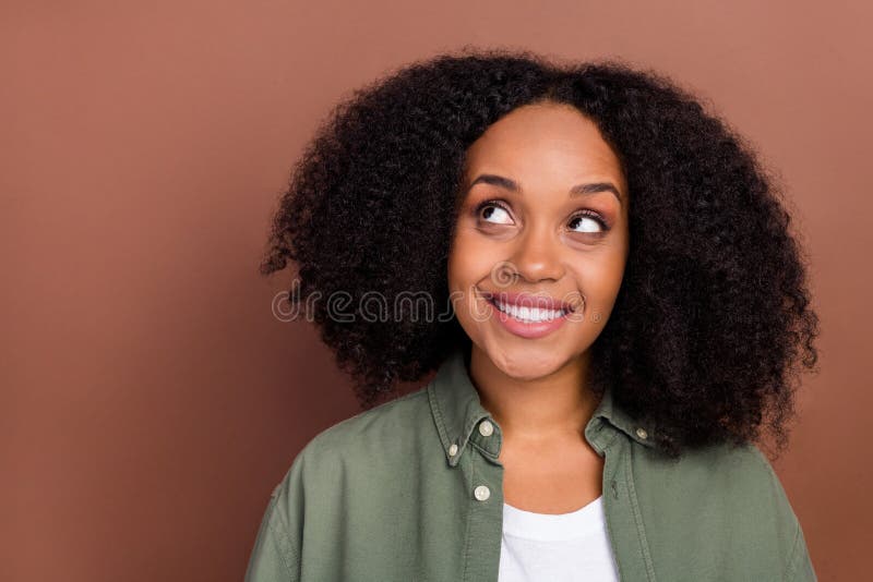 Photo of Impressed Brunette Young Afro Hairstyle Lady Look Empty Space Wear  Khaki Shirt Isolated on Brown Color Stock Image - Image of cheerful,  interested: 234951281