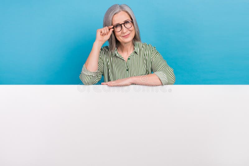 photo-of-intelligent-retired-business-woman-touch-eyewear-grey-hair-striped-shirt-hand-on-huge