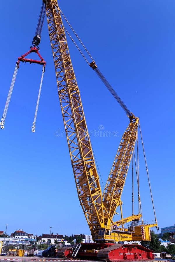 Lattice boom crane at construction site