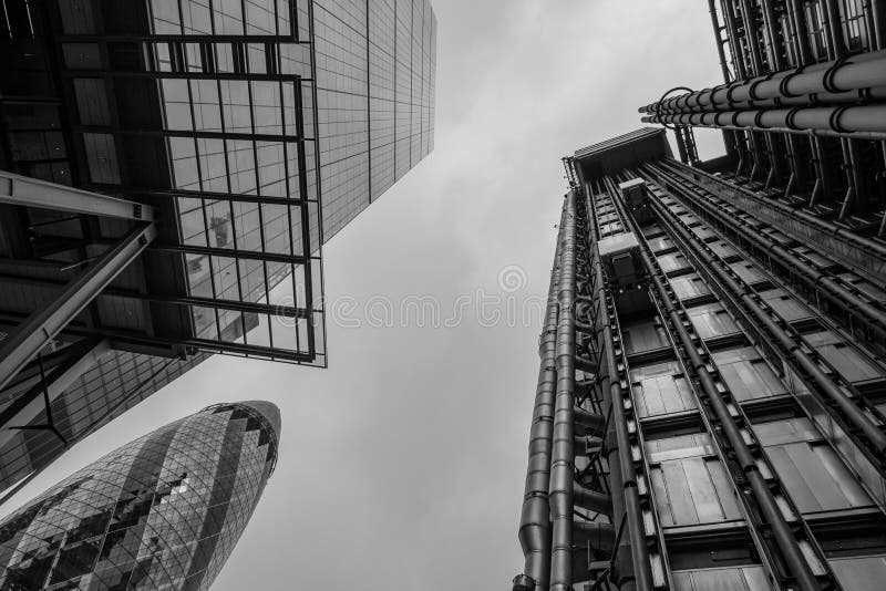 Photo looking upwards showing the Lloyds of London building, The `Cheesegrater`, The Willis Building and The Ghe