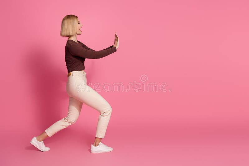 Photo of lovely funny crazy girl wear trendy brown clothes push empty space on pink color background stock images