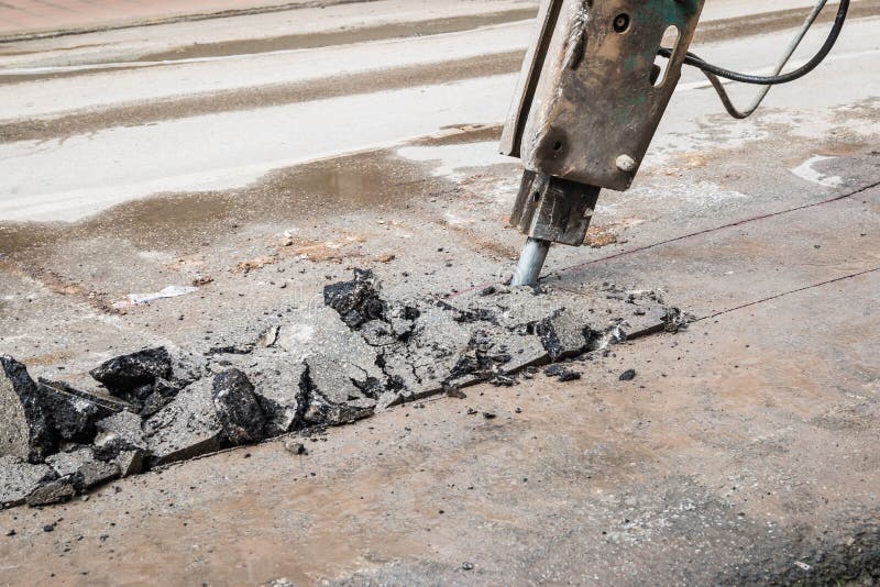 Machine drilling road stock image