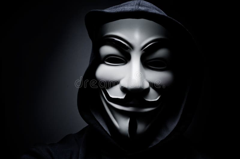 Photo of man wearing Vendetta mask. This mask is a well-known symbol for the online hacktivist group Anonymous.