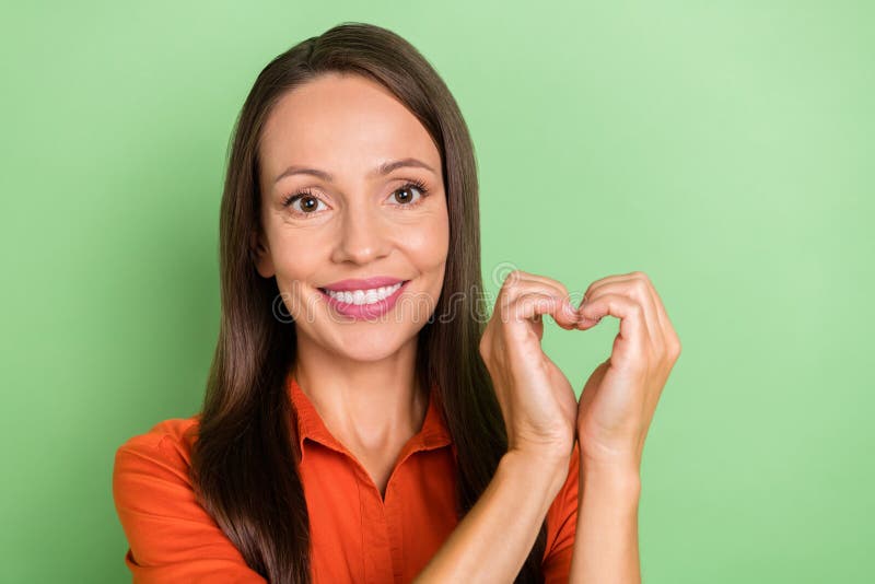 Photo Of Mature Adorable Woman Demonstrate Fingers Heart Figure Cardiac