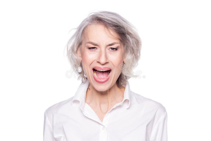 Shouting, headache and elderly woman in bed with insomnia, vertigo or  menopause in her home. Scream Stock Photo by YuriArcursPeopleimages