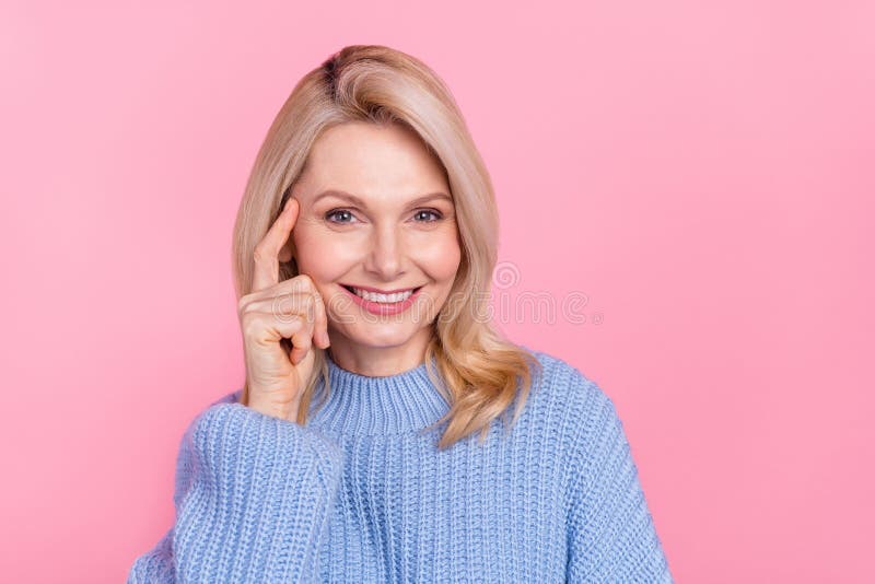 Photo Of Mature Smart Blond Lady Finger Head Wear Blue Pullover Isolated On Pink Color