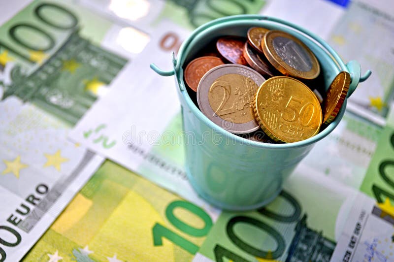 Photo of money, paper bills lying on the table. Bright image of money, euros in sunlight.