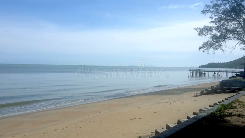 This photo of the natural landscape of a long sand beach in the city of Singkawang, West Kalimantan