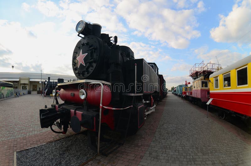 Photo of old black steam locomotives of the Soviet Union. Strong distortion from the fisheye len royalty free stock photos Photo of old black steam locomotives of the Soviet Union. Strong distortion from the fisheye len royalty free stock photos