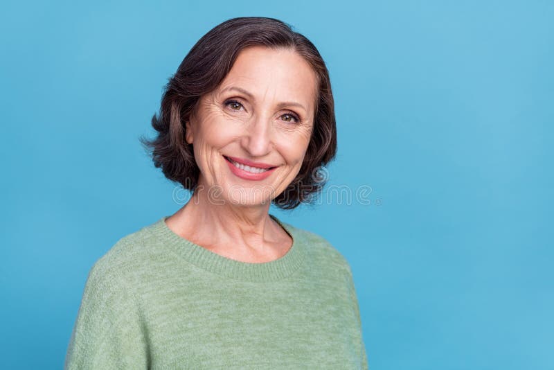 Photo of old grey hair optimistic woman wear green sweater isolated on blue color background