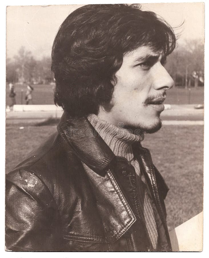 A black and white photograph of a young man in the late 70s in New York America on a white background. A black and white photograph of a young man in the late 70s in New York America on a white background