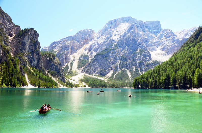 People having a rest time at the mountain lake in italian alps stock image People having a rest time at the mountain lake in italian alps stock image