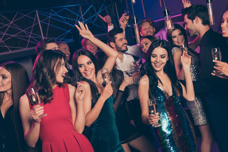 Photo Portrait of People at Nightclub Dancing Holding Champagne Glasses ...